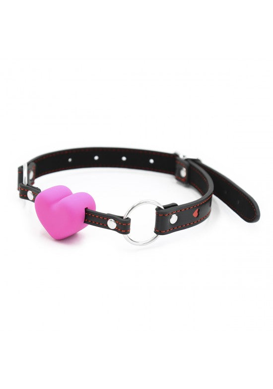 Mordaza con bola de silicona rosa fucsia y correa de cuero negro con remaches plateados