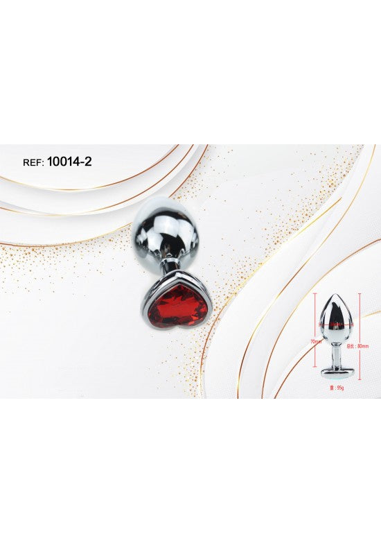 Plug anal de metal plateado con base decorativa en forma de corazón y cristal rojo