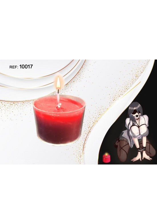 Vela erótica en vaso de cristal color rojo encendida